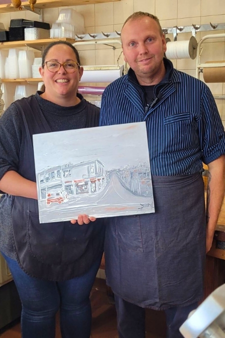 photo of 3 people in a butcher’s shop